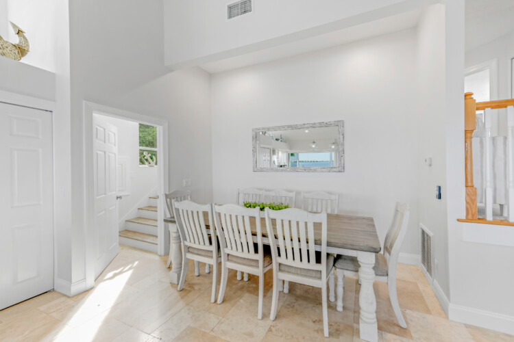 Image of dining area with bay view at Sunrise Bay Florida Short Term Rental in Holmes Beach, Manatee County, Florida
